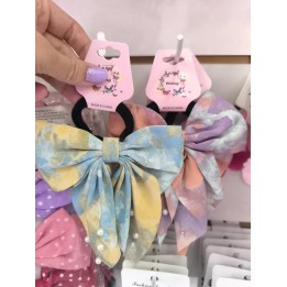 Colita moño con perlitas